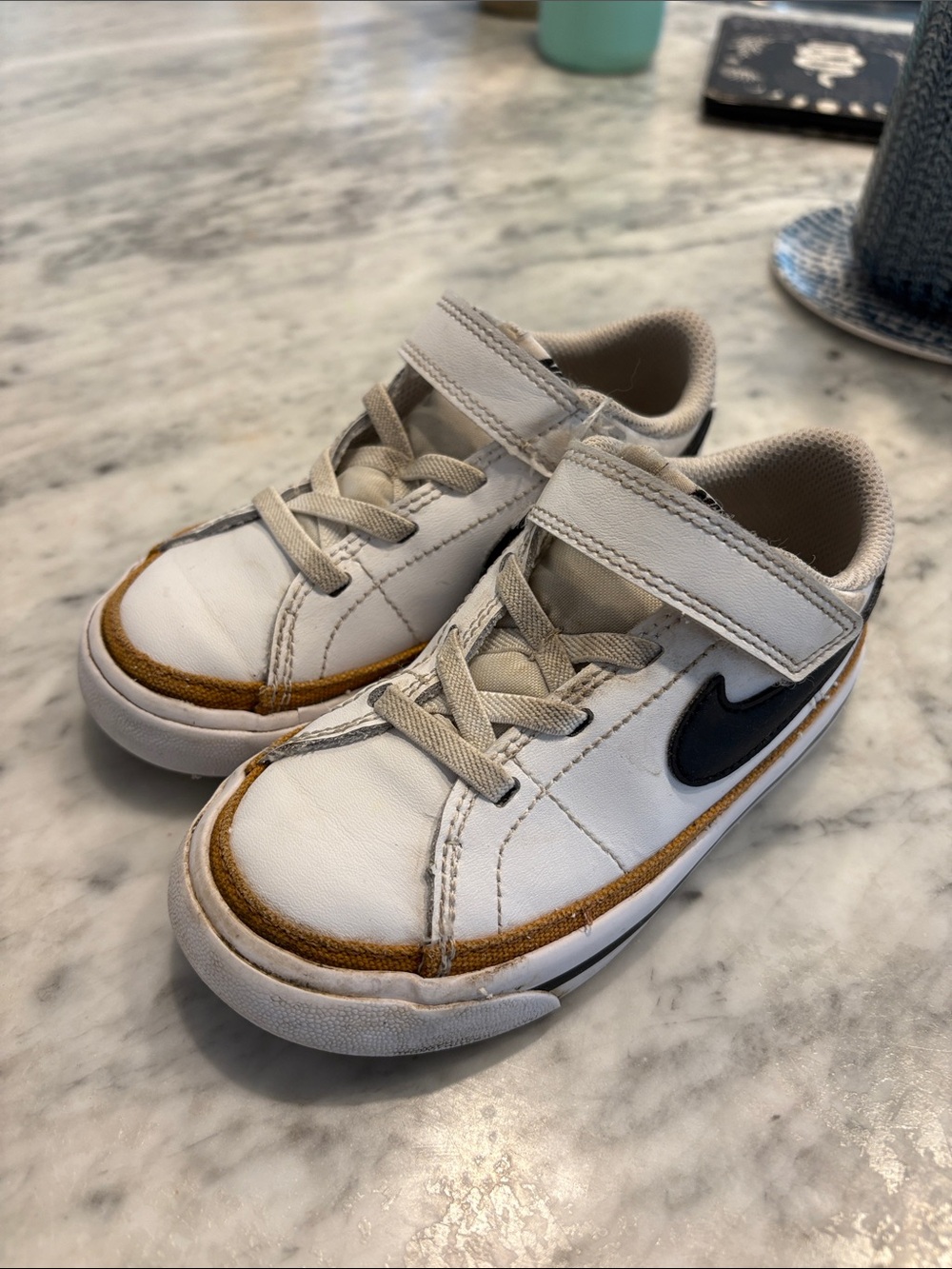 Nike Kids White Sneaker with Brown Trim & Black Swoosh